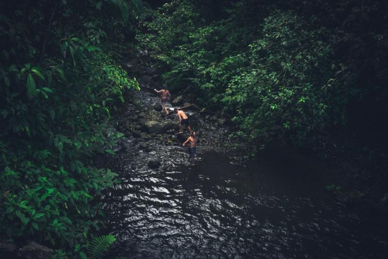 Men adventuring in river, Lombok